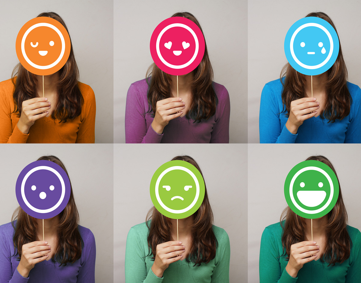 Six photos displaying six different emoji masks being held up in front of a female's face.